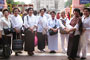 Buddhist pilgrims pose in front of the monastery.