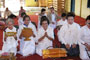  Thai Buddhist pilgrims making their offerings delightfully in the next morning. 