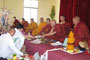 A representative of Thai Buddhist pilgrims carrying offerings to make to the Abbot of Mahabodhi Daiyun temple.